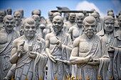 Ksitigarbha Bodhisattva buddhist temple in Bintan, Indonesia - Buddhist umbrella full of 500 statues with expression told of Ksitigarbha Bodhisattvas at the temple in Bintan, Indonesia. Ksitigarbha Bodhisattva is often referred to as the Bodhisattva of the Hell beings because of his vow to not achieve Buddhahood until all the Hells are empty. However, his vow actually encompasses all sentient beings, similar to that of Living Buddha Lien-Shen. He vows to reveal all the secrets of even the hidden teachings, in order to save sentient beings, even if he has to suffer retribution, and the pulveriz