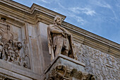 Detail of the Arch of Constantine, a triumphal arch in the Colosseum Archeological Park in Rome, Italy.