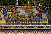 A colorful ceramic tile bench with a rustic scene at a ceramic shop on the Amalfi Coast of Italy.