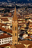 View of the bell tower of the Badia Fiorentina as seen from the Palazzo Vecchio tower in Florence, Italy.