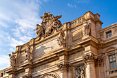 The Papal coat of arms on the rear of the Palazzo Poli above the Trevi Fountain in the Piazza di Trevi in Rome, Italy.