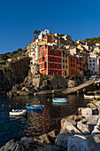 Colorful buildings overlooking the harbor in Riomaggiore, Cinque Terre, Italy.