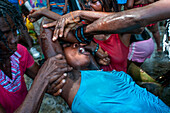 Haiti Voodoo Festival in Saut d'Eau, in Saut d'Eau, Ville Bonheur, Haiti. Thousands of both Vodou and Catholic followers gathered under the Saut d'Eau waterfall in Haiti. The pilgrimage, made by Voodou practitioners and Catholics alike, originated with the sighting of the likeness of the Virgin Mary on a palm leaf close to the falls half a century ago. Catholism and Voodou practices are forever intertwined in its Haitian form. The appearance of a rainbow beneath the falls is said indicate that Danbala - the great lord of the waterfall - and Ayida Wedo - the rainbow - are making love. Fertility