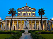 The statue of St. Paul and facade of the Basilica of St. Paul Outside the Walls, Rome, Italy.