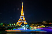 Eiffel Tower in the night with river Seine, Paris, Île-de-France, France