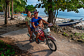 Local people, many people driving a motorcyce in Malapascua island, Cebu, Philippines