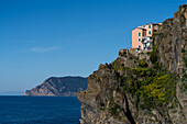 A small hotel on the cliff above the Ligurian Sea at the Cinque Terre town of Manarola, Italy.