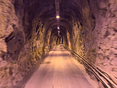 Driving through a tunnel through the marble quarry mountain after a quarry tour at Carrara, Italy.