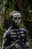 The Skeleton Men from the Omo Bugamo tribe of Papua New Guinea paint their bodies with black and white paint emulating the human skeleton, Chimbu Province, Papua New Guinea