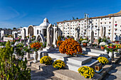 Flowers decorate the graves in a cemetery in Anacapri on the island of Capri, Italy.