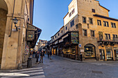 View over the Ponte Vecchio pedestrian bridge from the north end, looking south across the bridge. Florence, Italy