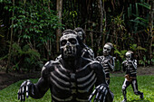 The Skeleton Men from the Omo Bugamo tribe of Papua New Guinea paint their bodies with black and white paint emulating the human skeleton, Chimbu Province, Papua New Guinea