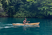 Residents of Vitu Islands in their traditional dugout canoes, Garove Island, Johann Albrecht Harbour, Papua New Guinea