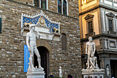 Statues of David & Hercules and Cacus in the Piazza della Signori, Florence, Italy. The statues are in front of the Palazzo Vecchio