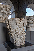 Figured Corinithian capital with a Gorgon originally from Attica, Greece in the Colosseum. Rome, Italy. Used as decoration in the top level of the Colosseum.