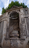 A niche in the Theater of Fontanone on the edge of Palatine Hill in the Colosseum Archaeological Park. Rome, Italy.