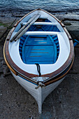 A wooden rowboat hauled out on the ramp in the Marina Grande harbor on the island of Capri, Italy.