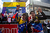 Supporters of Nicolas Maduro's government celebrate on their platforms, prior to the presidential swearing-in on January 10, 2025.