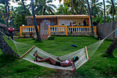 Local people in a luxury house next to the plage de Ti Mouillage beach in Cayes-de-Jacmel, Cayes de Jacmel, Jacmel, Haiti.