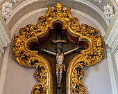 A metal sculpture of the crucifixion of Christ in the crypt of the Basilica of Sant'Antonino, Sorrento, Italy.