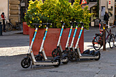 Bird electric scooters for rent for transportation in the Piazza del Duomo in Florence, Italy.