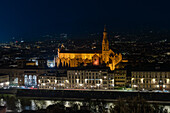 The Basilica di Santa Croce & RIver Arno viewed at night from the Piazzale Michelangelo, Florence, Italy.