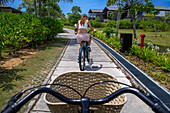 Bicycle tour inside the The residence luxury resort, Bintan island, Riau islands, Indonesia