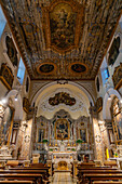 The painted ceiling of the nave of the Church of Santa Maria delle Grazie in Sorrento, Italy.