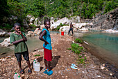 Exploring the cobalt waters of Bassin Bleu waterfall composed of bassin yes, bassin palmiste and bassin clair, Maire de Jacmel, Jacmel, Haiti