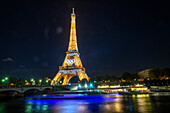 Eiffel Tower in the night with river Seine, Paris, Île-de-France, France