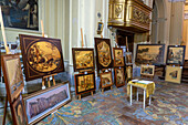 Intarsia or a handcrafted inlaid wood art pictures on display in the Church of San Paolo in Sorrento, Italy.