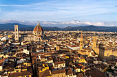 View of the Duomo or Cathedral of Santa Maria del Fiore from the Palazzo Vecchio tower in Florence, Italy. At right are the towers of the Badia Fiorentina and Palazzo del Bargello.