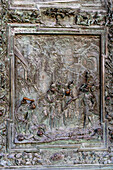 Detail of a main portal door of the Duomo of Pisa. Cast in bronze in 1605 by Giambologna. Pisa, Italy.