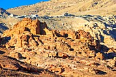 Ruin of Moghar Annassara (Christian Tombs ) in Petra and Uum Sayhoun village at background, Jordan. Petra aerial view perspective of the ancient caves and sacred tombs and in the background the new city of Uum Sayhoun, Petra Jordan