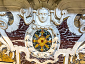 Baas relief marble sculpture and marble inlay in the crypt of the Basilica of Sant'Antonino, Sorrento, Italy. The inlaid floral pattern is also called Florentine mosaic or commessa.