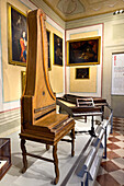 An original upright piano by Domenico del Mela in the Accademia Gallery in Florence, Italy. circa 1739. This is probably the first piano ever built with this vertical design.