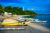 Local fish boats in Guimbitayan beach next to white sand beach in Malapascua island, Cebu, Philippines