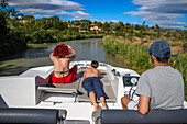 Canal du Midi at Le Somail Aude South of France southern waterway waterways holidaymakers queue for a boat trip on the river, France, Europe