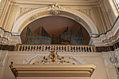 Organ loft and organ pipes in the Sanctuary of the Madonna del Carmine in Sorrento, Italy.