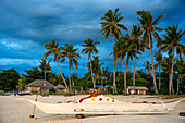 Local fish boats in white sand beach in of Langub Beach Malapascua island, Cebu, Philippines