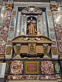 The tomb of Ferdinando I in the Chapel of the Princes in the Medici Chapel Museum in Florence, Italy. The sarcophagus is made of porphyry stone.