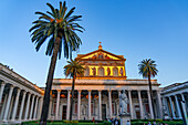 The statue of St. Paul and facade of the Basilica of St. Paul Outside the Walls, Rome, Italy.