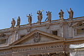 Statues on the roof of the facade of Saint Peter's Basilica in Vatican City in Rome, Italy.