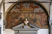 Fresco & bust on the wall of the portico of the Hospital of the Innocents or Foundling Hospital in Florence, Italy.