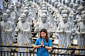 Ksitigarbha Bodhisattva buddhist temple in Bintan, Indonesia - Buddhist umbrella full of 500 statues with expression told of Ksitigarbha Bodhisattvas at the temple in Bintan, Indonesia. Ksitigarbha Bodhisattva is often referred to as the Bodhisattva of the Hell beings because of his vow to not achieve Buddhahood until all the Hells are empty. However, his vow actually encompasses all sentient beings, similar to that of Living Buddha Lien-Shen. He vows to reveal all the secrets of even the hidden teachings, in order to save sentient beings, even if he has to suffer retribution, and the pulveriz