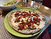 A gluten-free Pizza Capricciosa at the Da Franco Food Philosophy pizzeria in Sorrento, Italy.