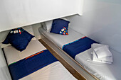 Beds inside a boat for a rent in the Canal of Midi trip on the river, France, Europe