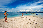 Tourists off a tiny tropical island beach in the Philippines Kalanggaman island, Malapascua, Cebu, Philippines