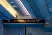 The digital readout of the speed of 300 km/h in a passenger coach on a high-speed train in Italy.