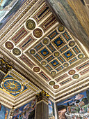 Ornate carved and gilded ceiling in the Magi Chapel in the Palazzo Medici Riccardi in Florence, Italy.